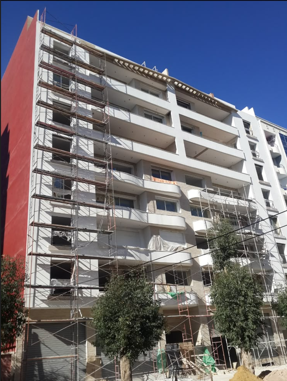 Résidence 48 logements mortier acrylique pierre beige talochée — Fès Ville Nouvelle